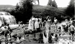 Sunday School picnic, circa 1950’s, at Bradley Farm on Huntley Creek.  Copyright Bradley family.